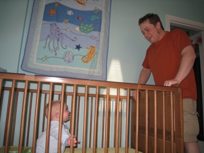 talking-to-daddy-in-crib